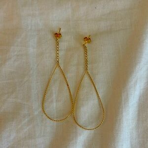 Gold post dangle earrings.
